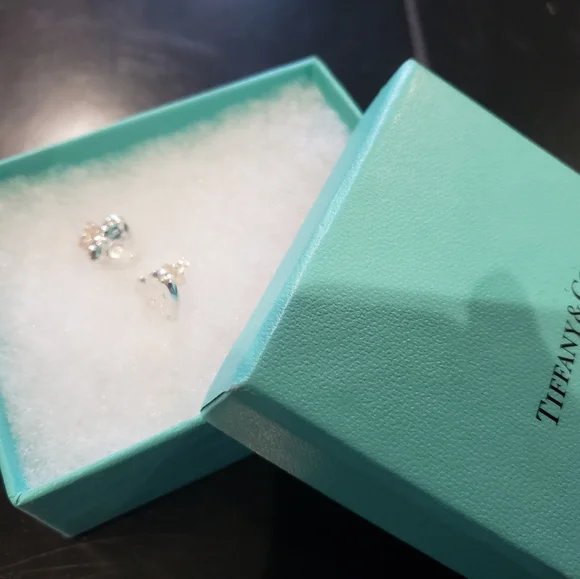 Bulova woman's watch & Tiffany &Co earings